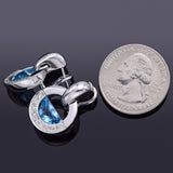 Movado 18K White Gold Blue Topaz & Diamond Omega-Back Radius Earrings 15.8 Grams