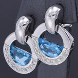 Movado 18K White Gold Blue Topaz & Diamond Omega-Back Radius Earrings 15.8 Grams